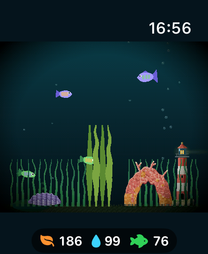 My Tiny Tank simulator screenshot: four fish above the grass, a sword plant, a giant clam, a coral arch and a lighthouse